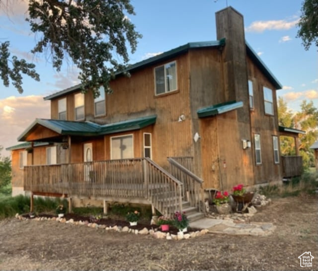 View of front of home with a chimney