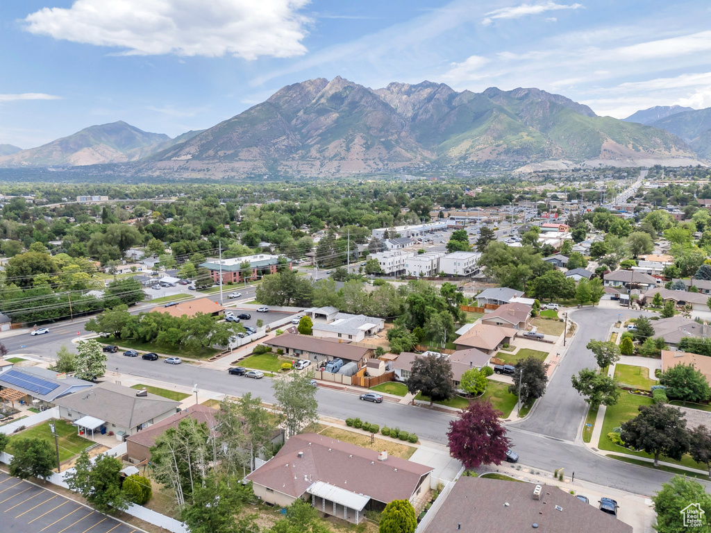 Aerial perspective of suburban area featuring a mountain backdrop