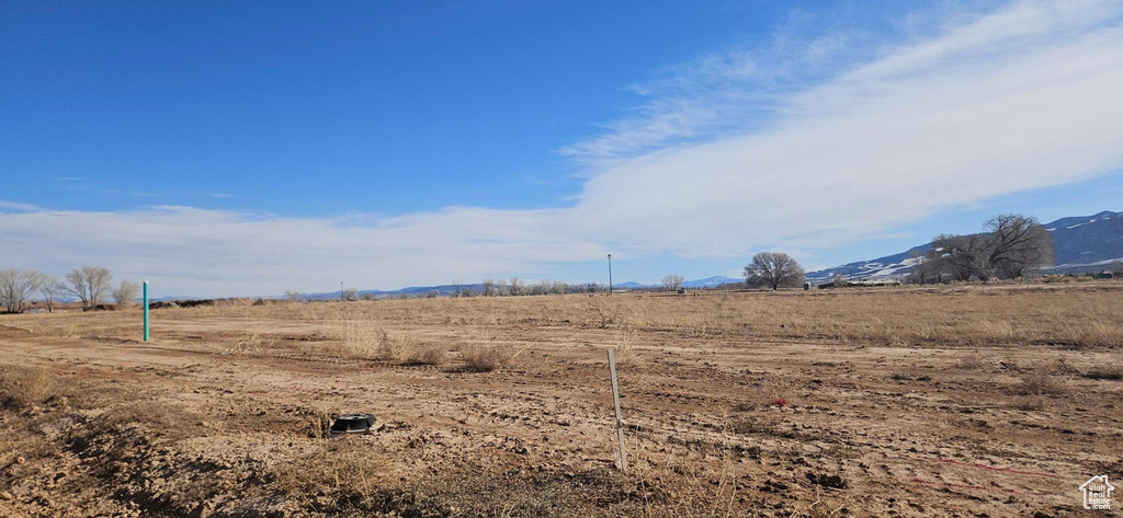 View of yard featuring a mountain view and a rural view