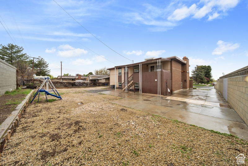 View of yard with a patio area and fence