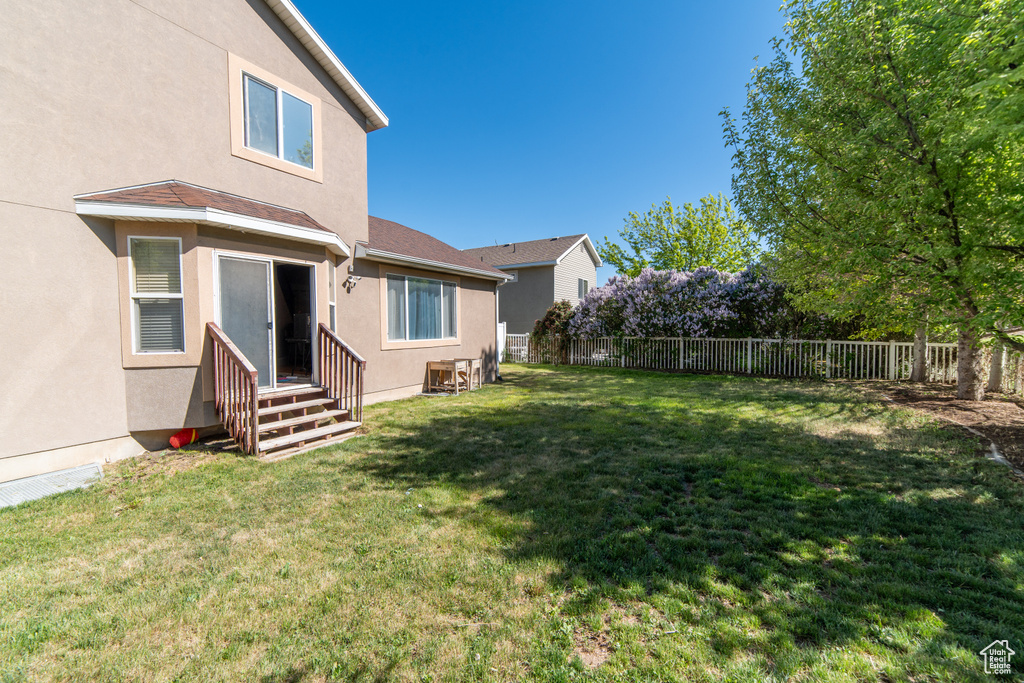 View of yard with entry steps