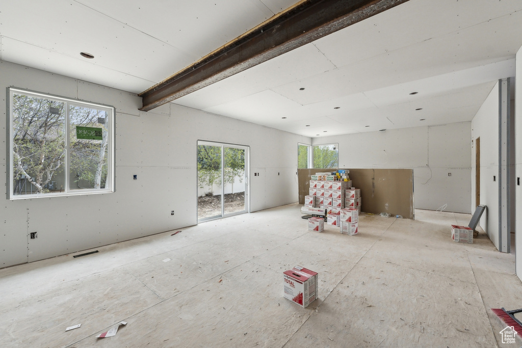 Unfurnished living room featuring visible vents