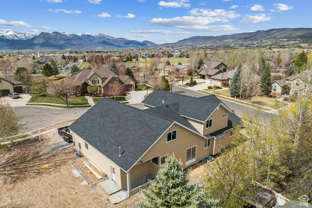 Birds eye view of property featuring a mountain view and a residential view
