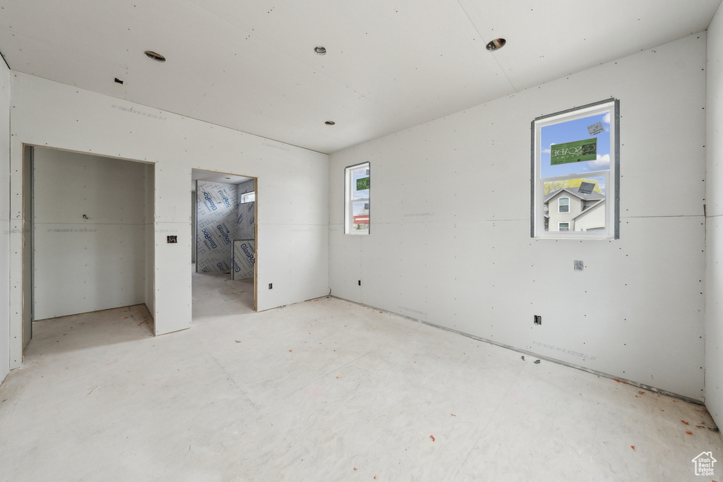 Unfurnished bedroom featuring ensuite bathroom