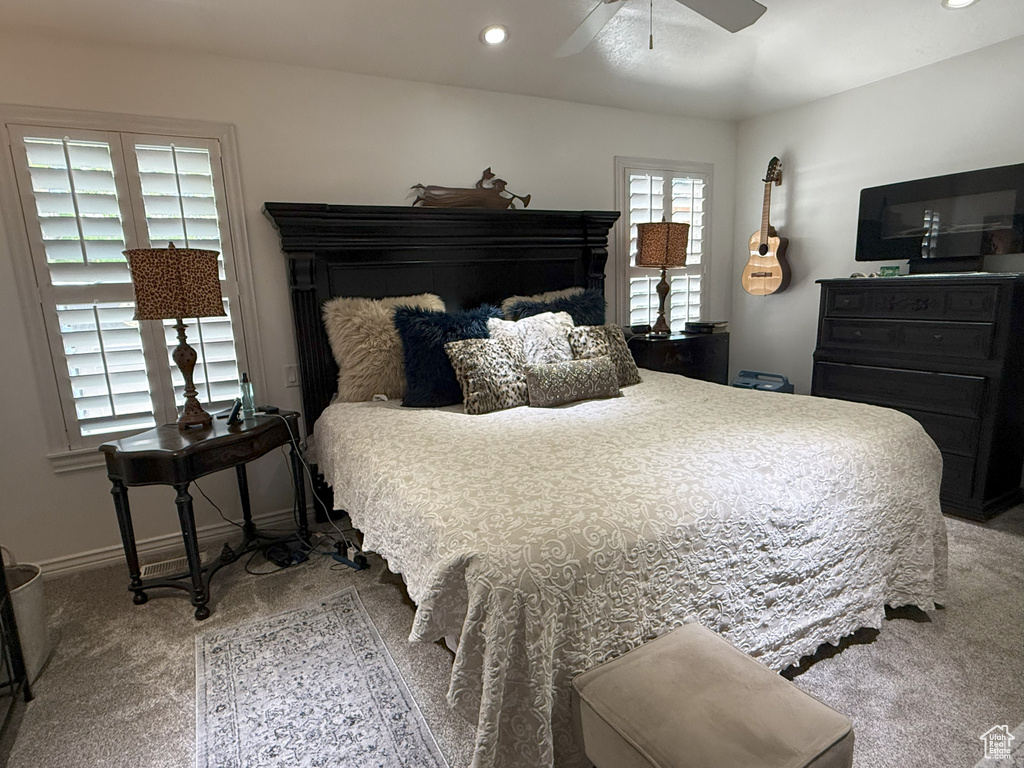 Carpeted bedroom with recessed lighting, a ceiling fan, and baseboards