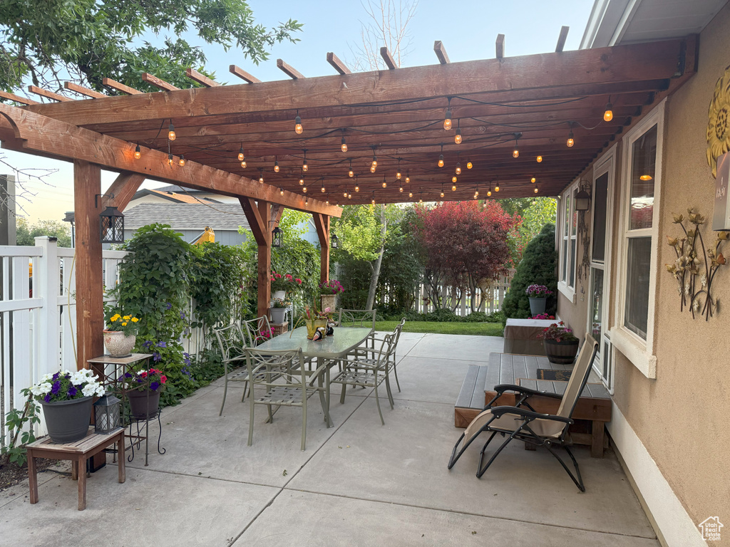 View of patio / terrace with outdoor dining area and a pergola