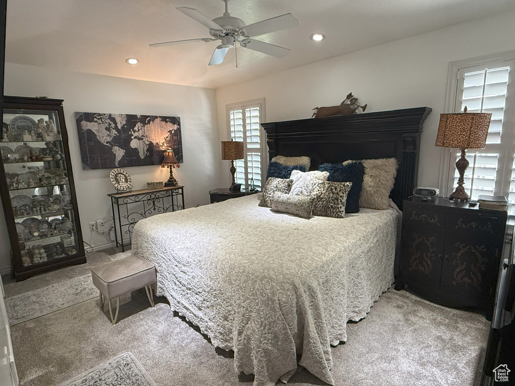 Bedroom with carpet floors, ceiling fan, and recessed lighting