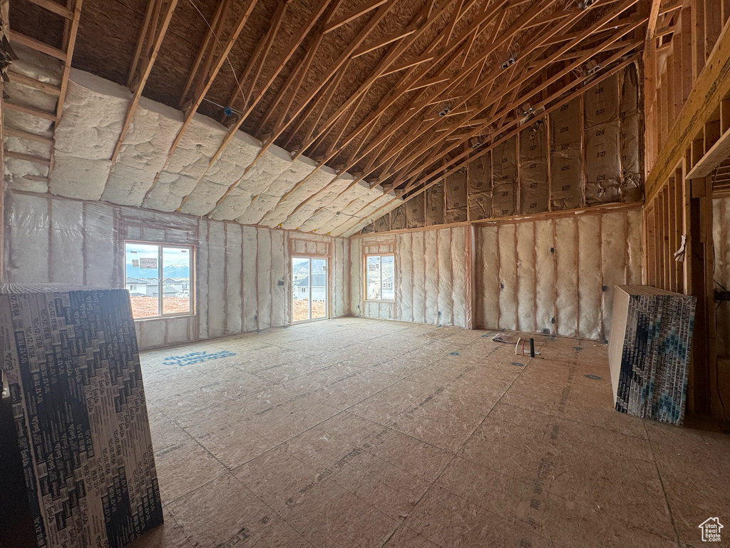 Misc room featuring plenty of natural light and vaulted ceiling