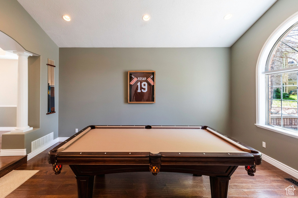 Playroom featuring ornate columns, billiards, wood finished floors, and recessed lighting