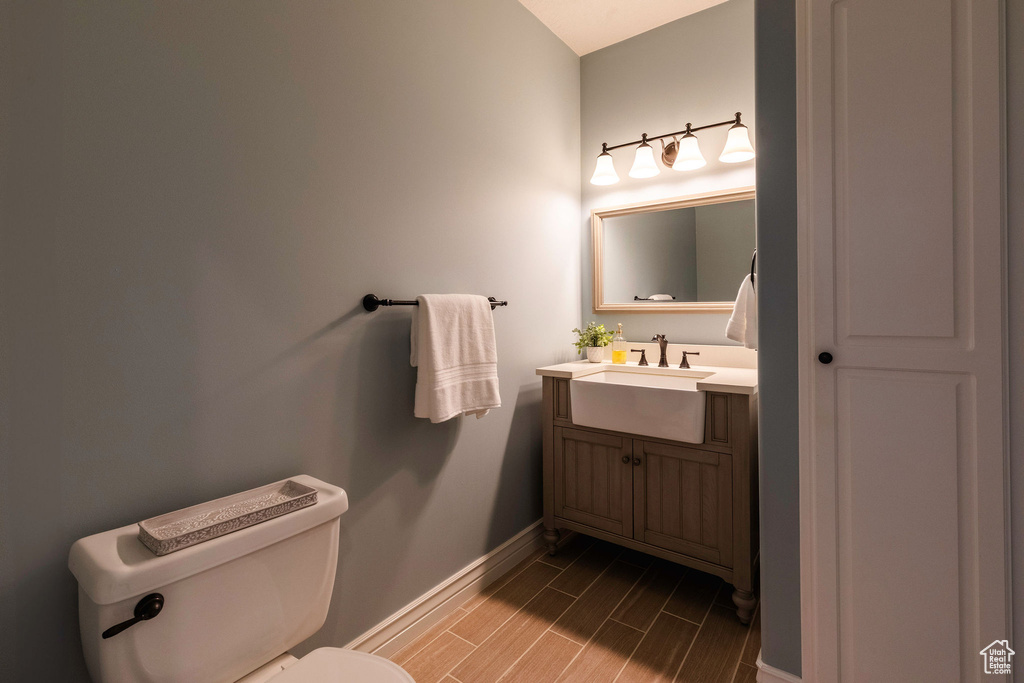 Bathroom featuring wood finish floors and vanity