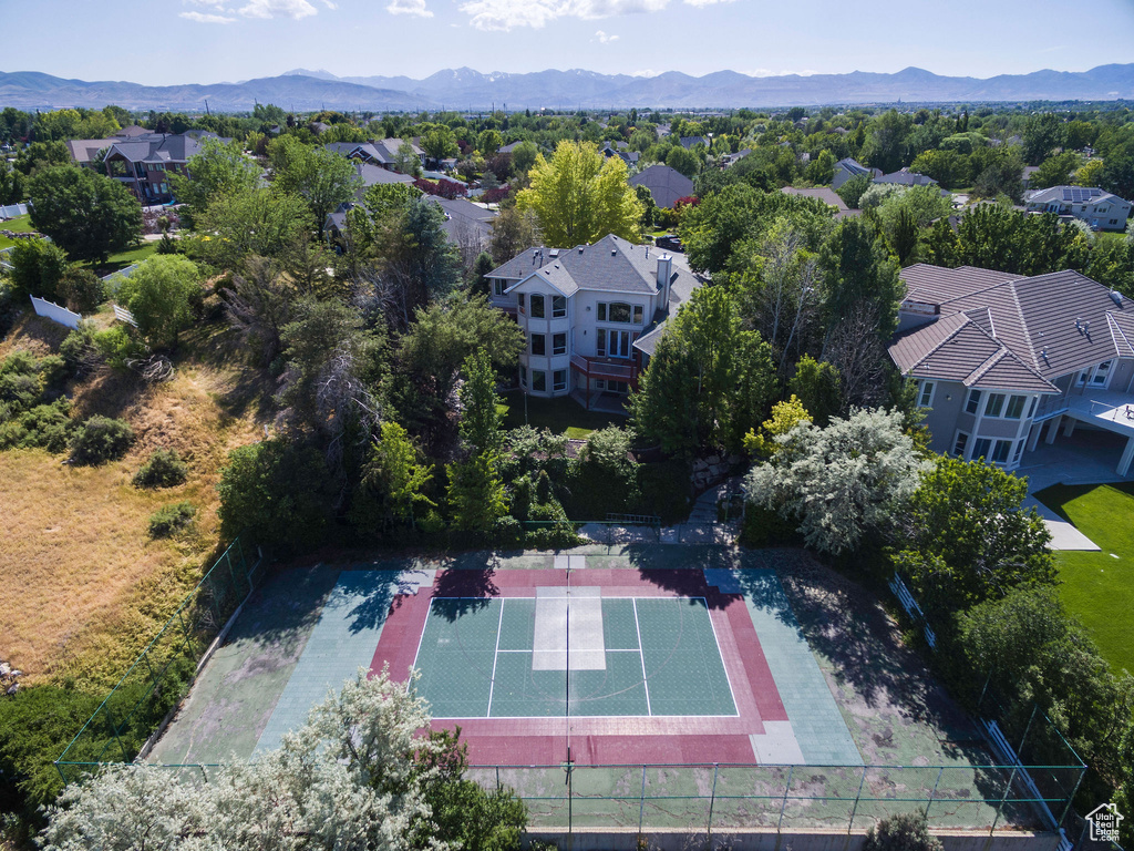 Aerial view of residential area featuring mountains