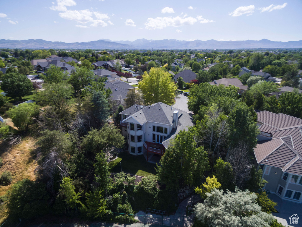 Aerial perspective of suburban area featuring a mountain backdrop