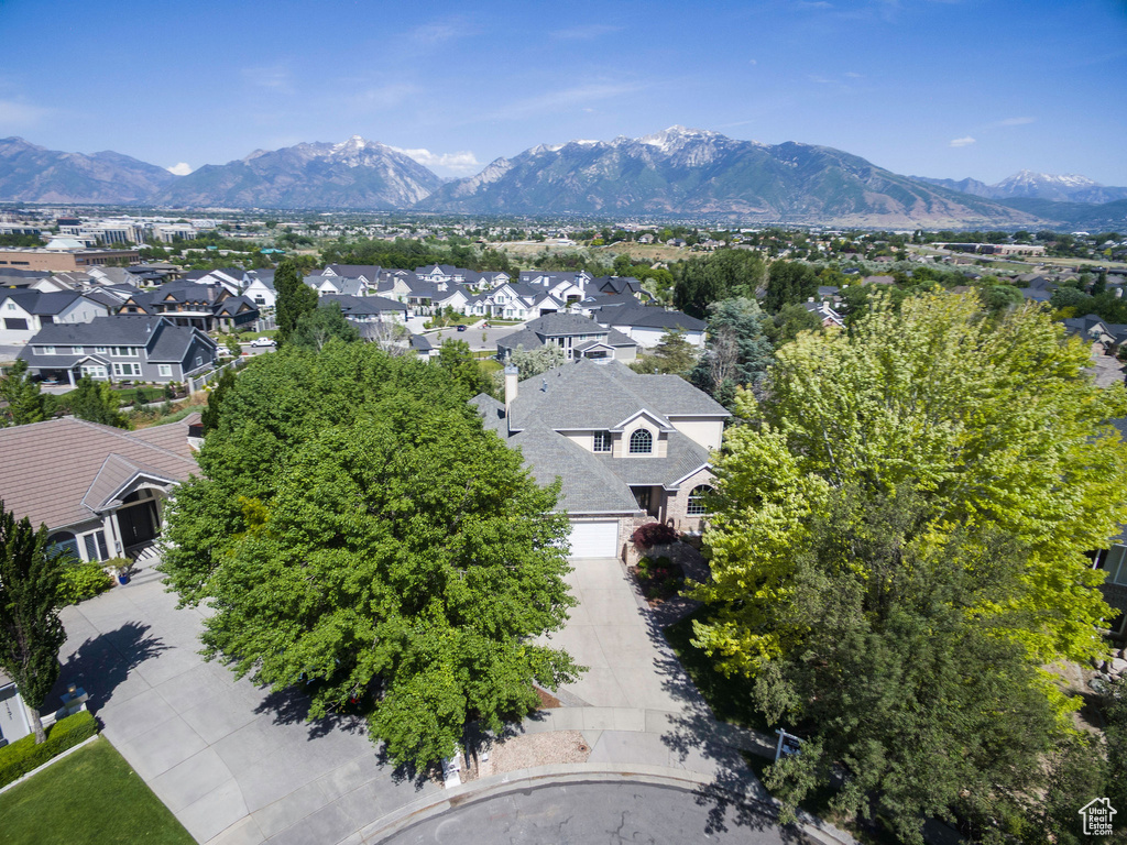 Aerial view of residential area featuring a mountain backdrop