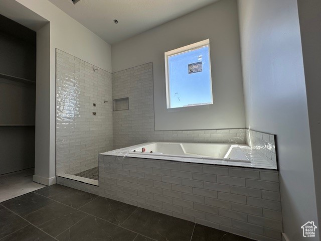 Full bathroom with a bath, walk in shower, and tile patterned floors