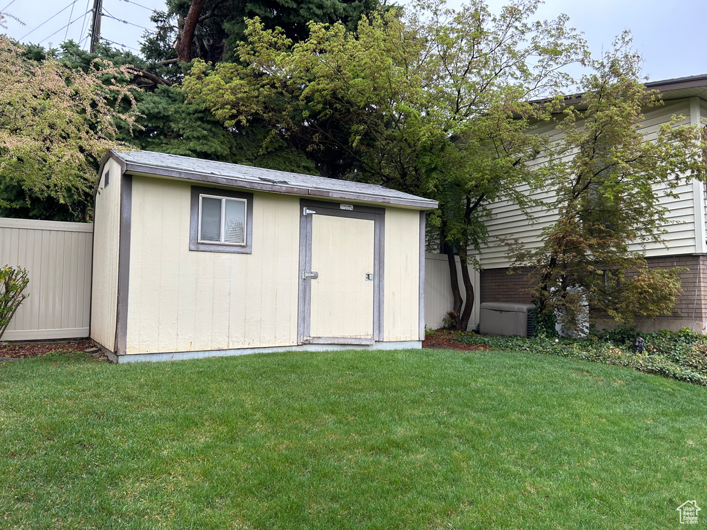 View of shed with fence
