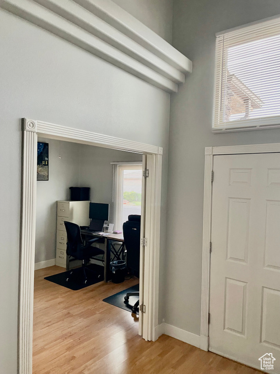 Home office with wood finished floors and baseboards