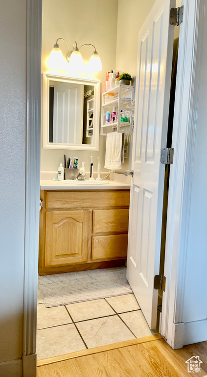 Bathroom featuring vanity and tile patterned flooring