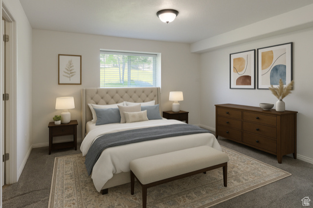 Carpeted bedroom featuring baseboards
