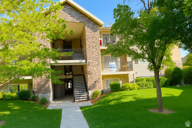 View of property with stairway
