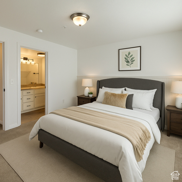 Bedroom featuring carpet and connected bathroom