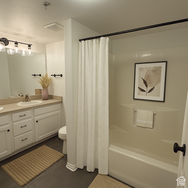 Full bath featuring vanity and shower / tub combo