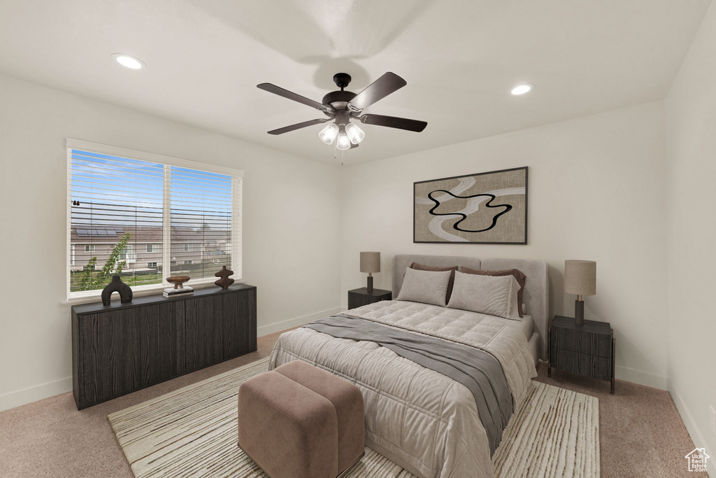 Bedroom with baseboards, light colored carpet, recessed lighting, and ceiling fan
