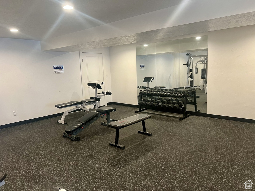 Workout area featuring baseboards and recessed lighting