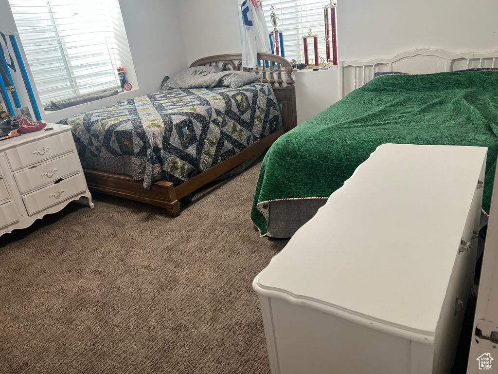 Bedroom with dark carpet