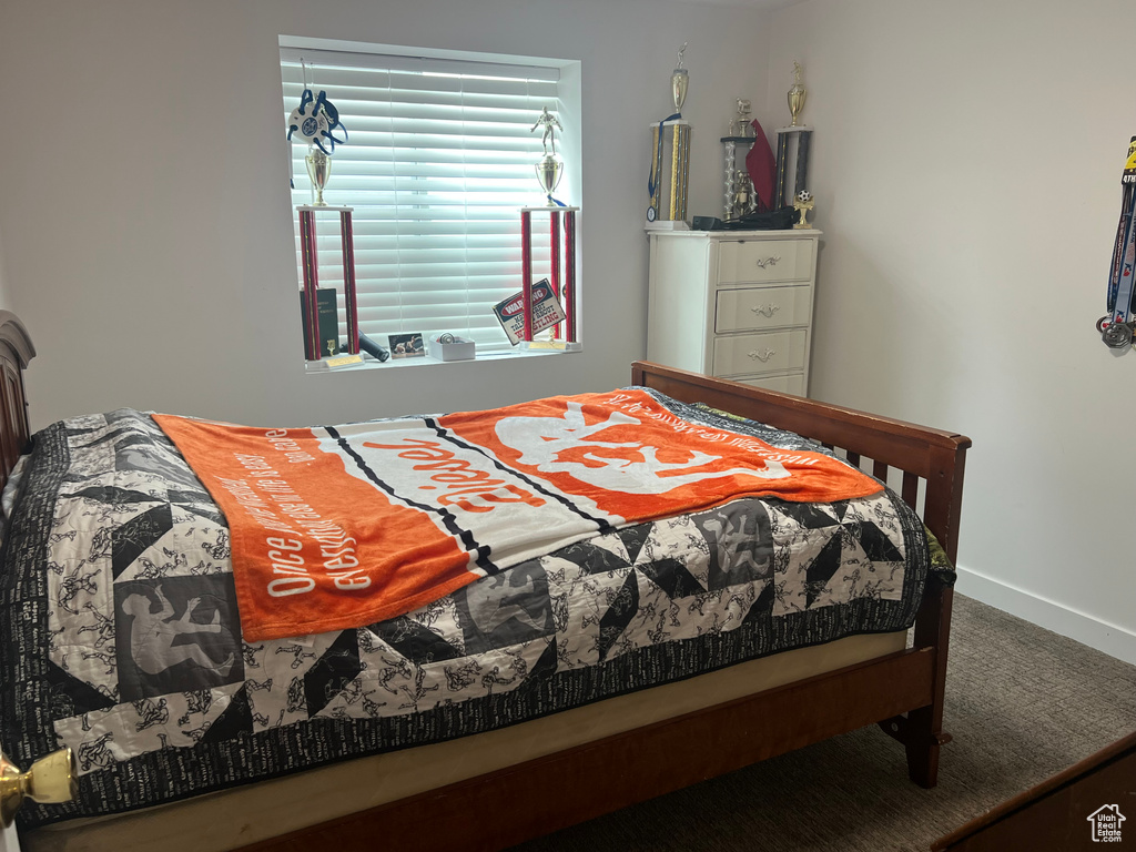 Bedroom with carpet and baseboards