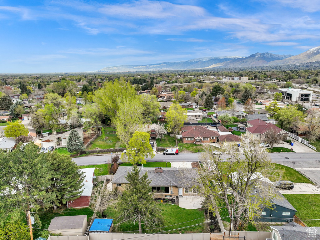 Birds eye view of property featuring a mountain view and a residential view