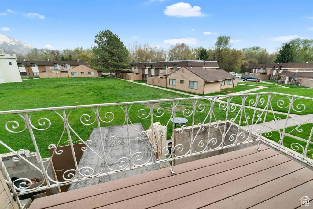 Exterior space with a yard and a residential view