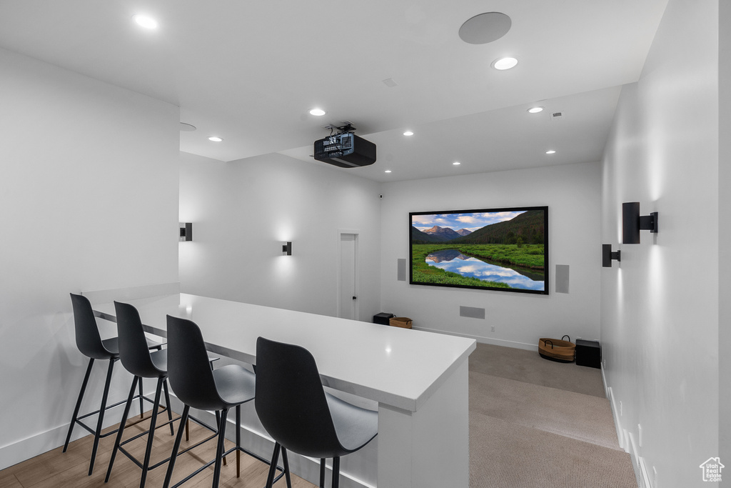 Cinema with recessed lighting and baseboards