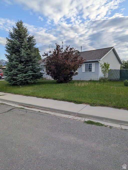 View of property exterior featuring roof with shingles