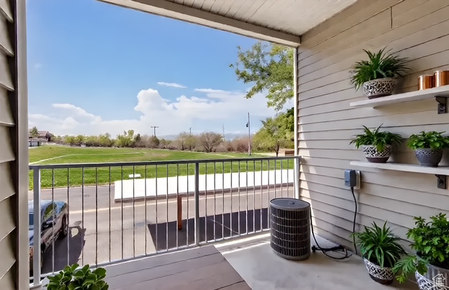 Balcony with view of golf course and central AC