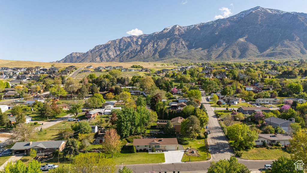 Birds eye view of property with a residential view and a mountain view