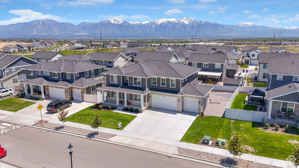 Aerial perspective of suburban area featuring a mountainous background