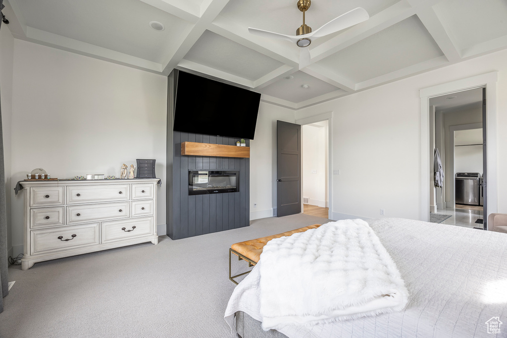 Bedroom featuring beamed ceiling, a ceiling fan, light colored carpet, and coffered ceiling