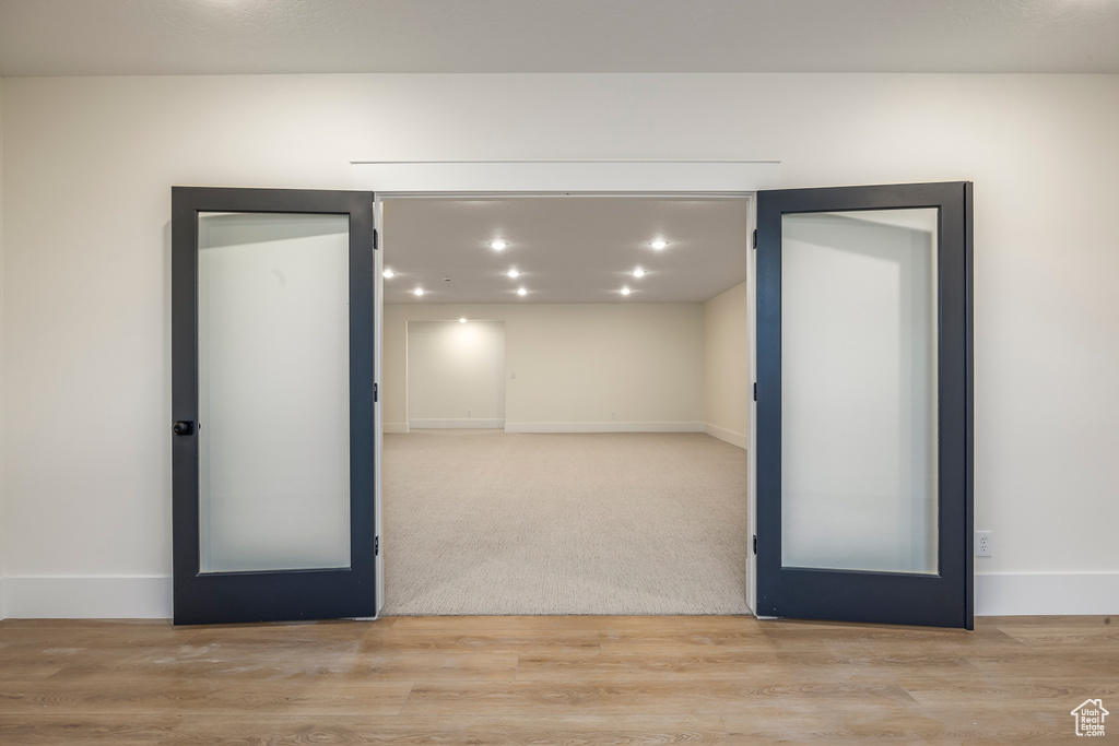 Unfurnished room featuring baseboards and wood finished floors