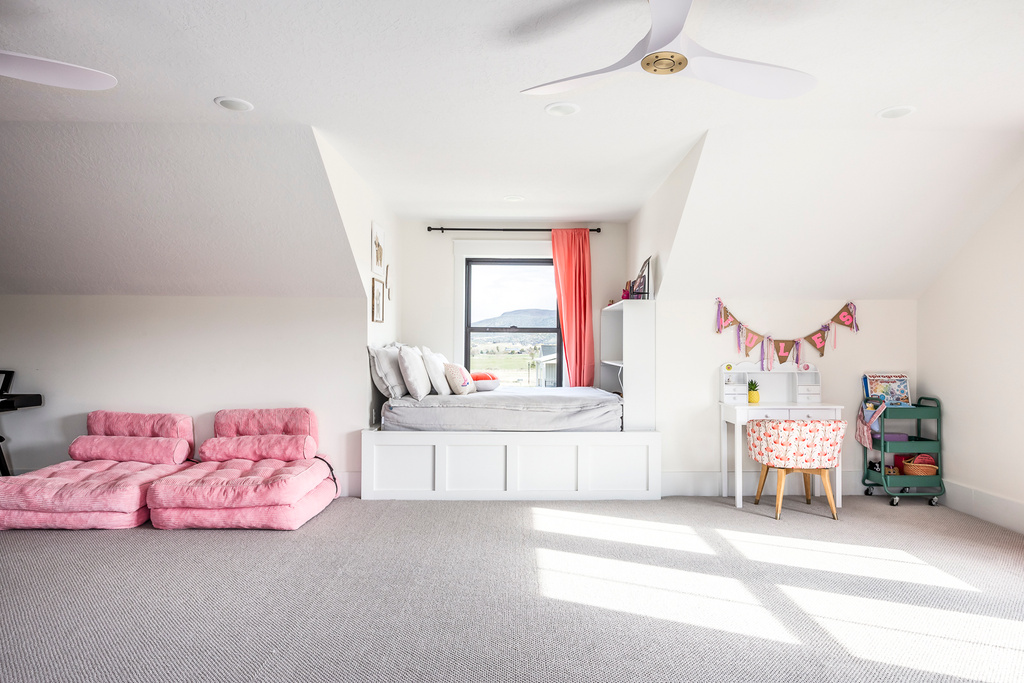 Playroom featuring carpet flooring and a ceiling fan