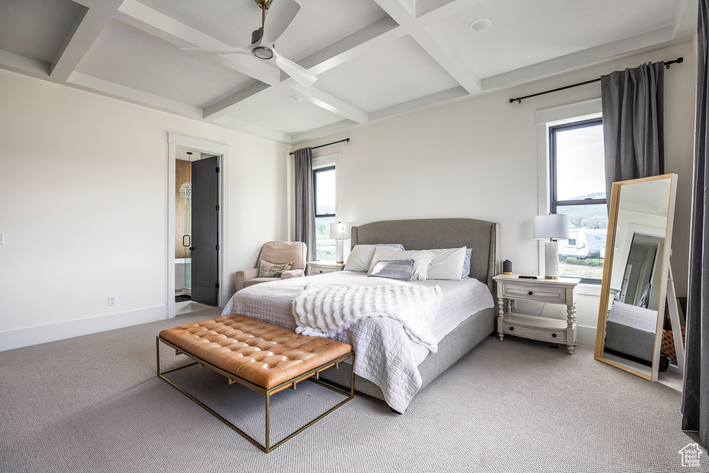 Bedroom with beamed ceiling, baseboards, light colored carpet, and coffered ceiling