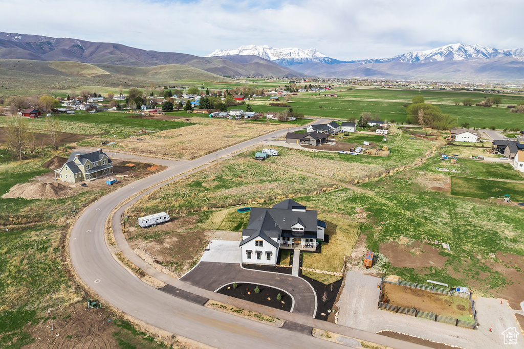 Birds eye view of property with a rural view and a mountain view