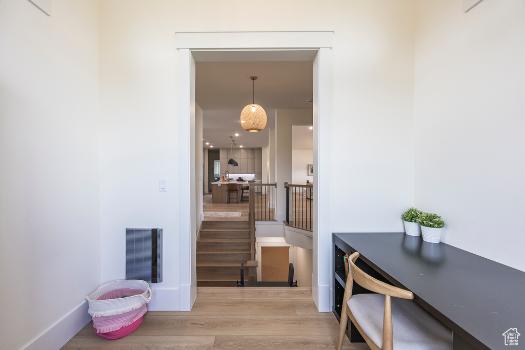 Hall featuring wood finished floors and visible vents