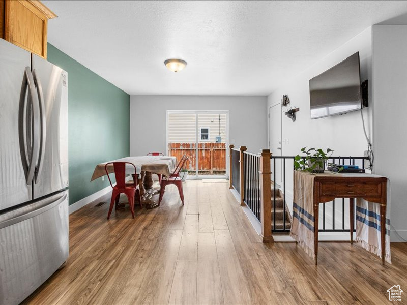 Interior space featuring baseboards and wood finished floors
