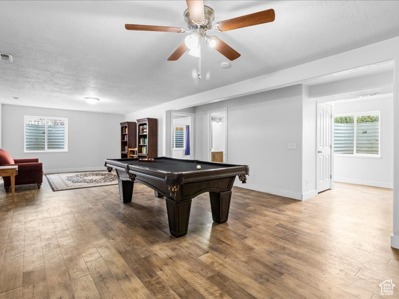 Recreation room featuring hardwood / wood-style floors, billiards, baseboards, and ceiling fan