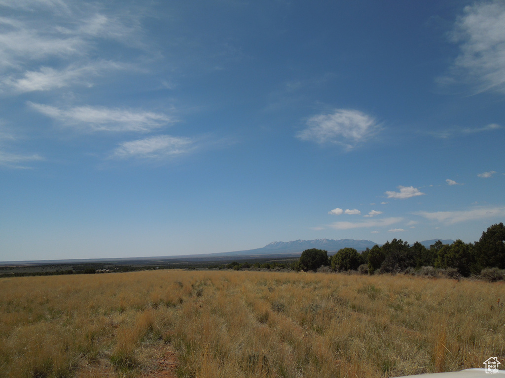 Property view of mountains with a rural view