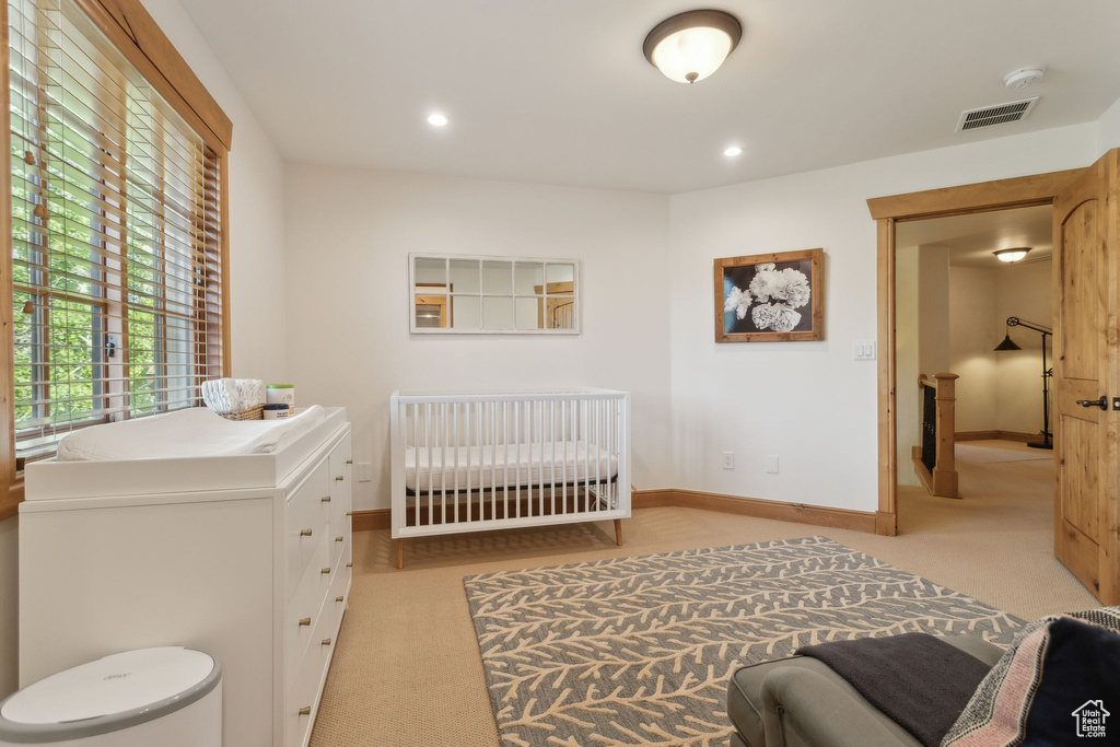 Carpeted bedroom with baseboards and recessed lighting