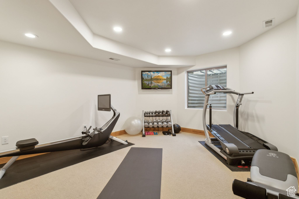 Exercise area with recessed lighting, carpet floors, and baseboards