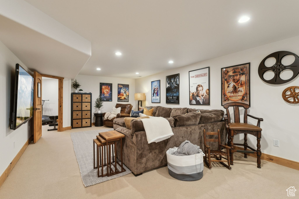 Living room featuring carpet floors, recessed lighting, and baseboards