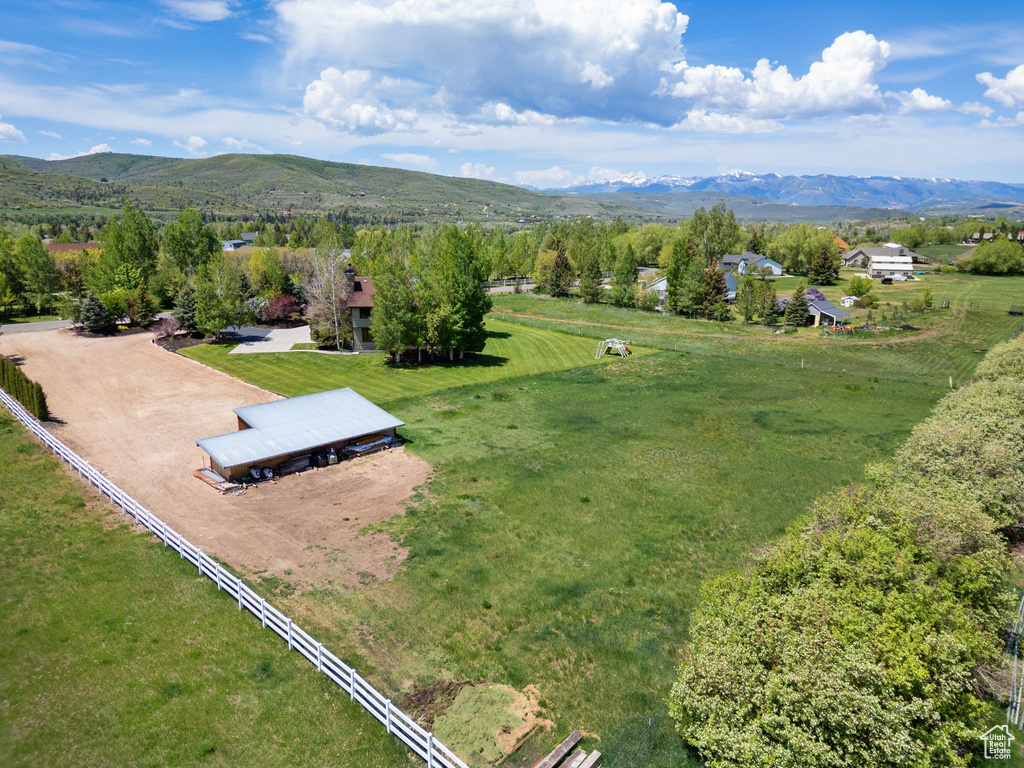 Aerial view of sparsely populated area with a mountainous background