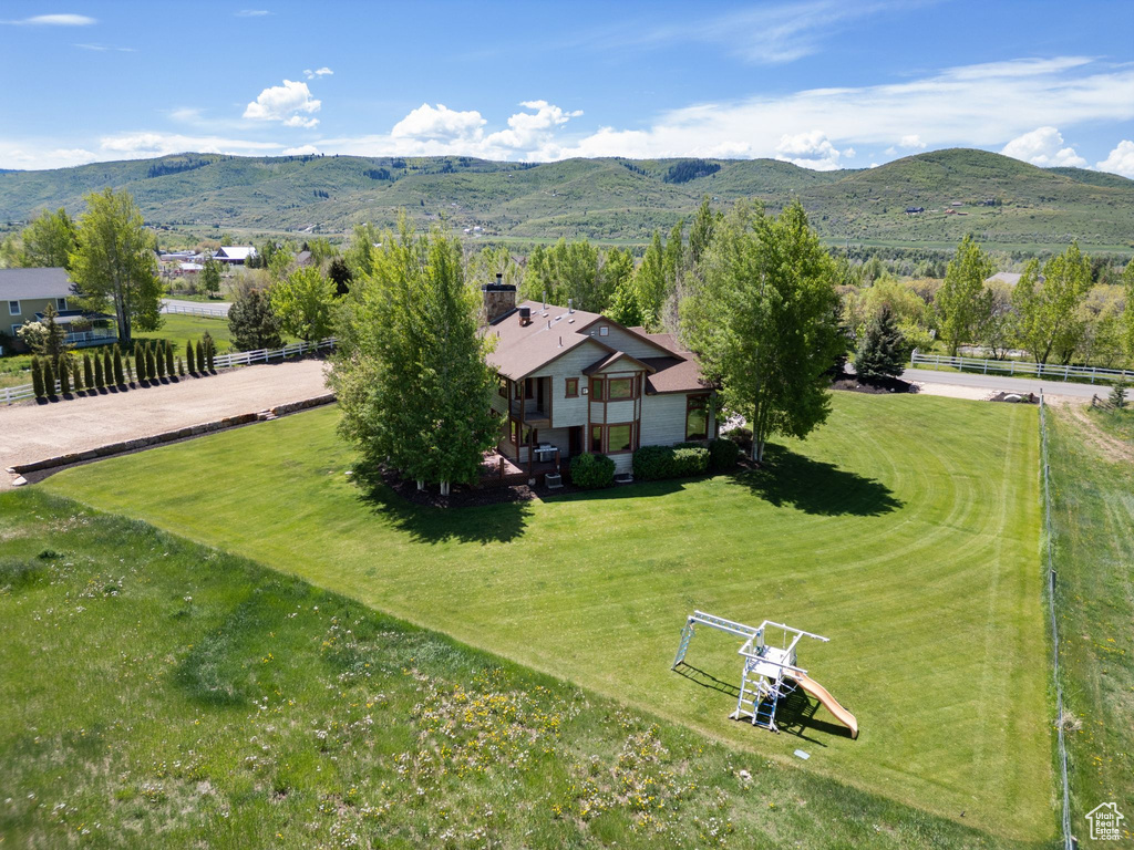 View of subject property with a mountain backdrop